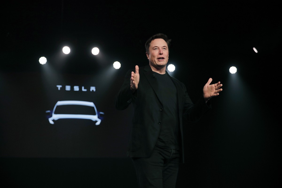 FILE- In this March 14, 2019, file photo Tesla CEO Elon Musk speaks before unveiling the Model Y at Tesla's design studio in Hawthorne, Calif. Tesla CEO Elon Musk says the electric car pioneer pl ...