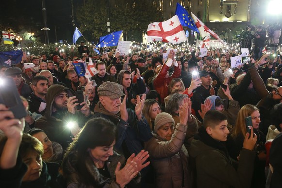 People attend a rally to protest against alleged violations in a recent parliamentary election in Tbilisi, Georgia, Monday, Nov. 11, 2024. (AP Photo/Zurab Tsertsvadze)