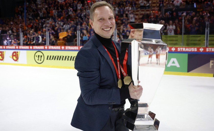Tappara&#039;s head coach Jussi Tapola poses with the trophy after winning the Champions Hockey League final ice hockey match between Lulea Hockey and Tappara Tampere at Coop Norrbotten Arena in Lulea ...