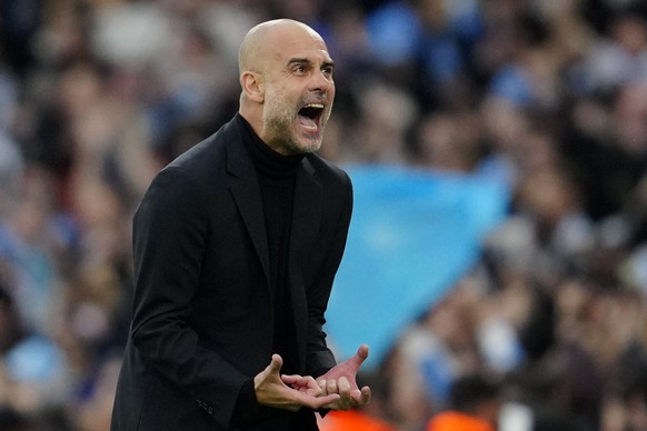 Manchester City&#039;s head coach Pep Guardiola reacts after Bernardo Silva scored the opening goal during the Champions League semifinal second leg soccer match between Manchester City and Real Madri ...