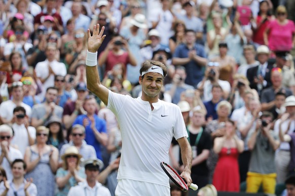 Roger Federer of Switzerland celebrates after beating Sam Querrey of USA in his second round match at the All England Lawn Tennis Championships in Wimbledon, London, Thursday, July 2, 2015. (KEYSTONE/ ...