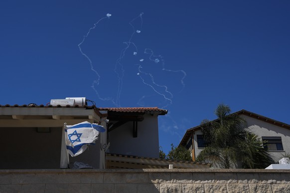 The Israeli Iron Dome air defense system fires to intercept rockets that were launched from Lebanon, as seen from Safed, northern Israel, on Saturday, Sept. 28, 2024. (AP Photo/Baz Ratner)
