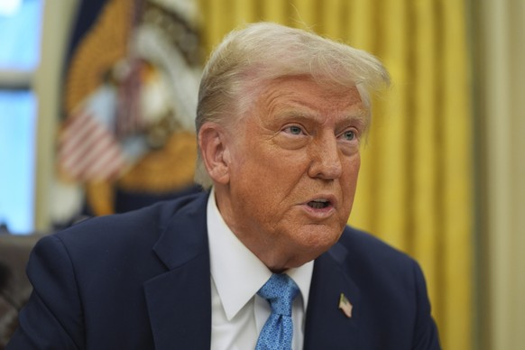 President Donald Trump speaks to reporters as he signs executive orders in the Oval Office of the White House, Friday, Jan. 31, 2025, in Washington. (AP Photo/Evan Vucci)
Donald Trump