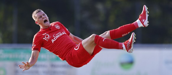 Elvin Ibrisimovic, top, of Vaduz, falls after a foul by Diary Abdoulaye of Ujpest during the UEFA Conference League second qualifying round soccer match between FC Vaduz and FC Ujpest Budapest at the  ...
