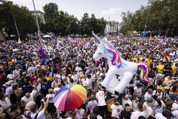 People take part in the Zurich Pride parade in Zurich, Switzerland, on Saturday, June 17, 2023. (KEYSTONE/Michael Buholzer)