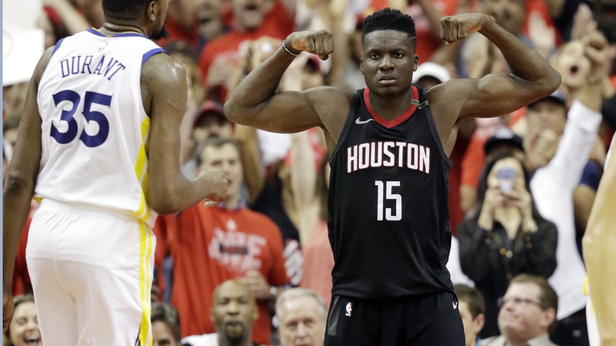 Houston Rockets center Clint Capela (15) celebrates after he scored against Golden State Warriors forward Kevin Durant (35) during the first half in Game 7 of the NBA basketball Western Conference fin ...