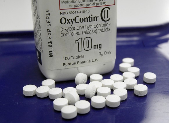 FILE - This Feb. 19, 2013, file photo, shows OxyContin pills arranged for a photo at a pharmacy in Montpelier, Vt. More than 28,000 Americans died from overdosing on opiates in 2014, a record high for ...