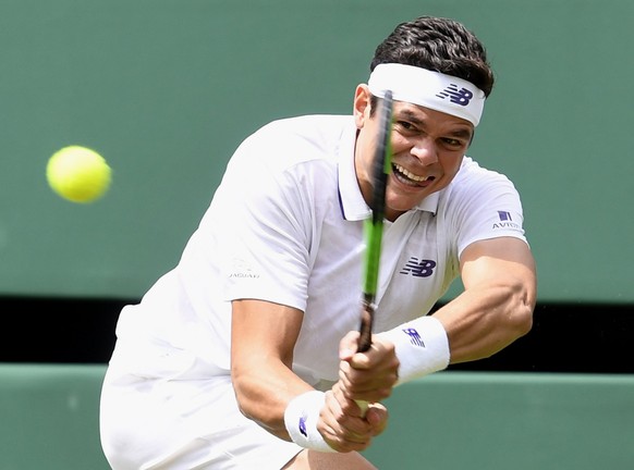 epa06065581 Milos Raonic of Canada in action against Jan-Lennard Struff of Germany during their first round match for the Wimbledon Championships at the All England Lawn Tennis Club, in London, Britai ...