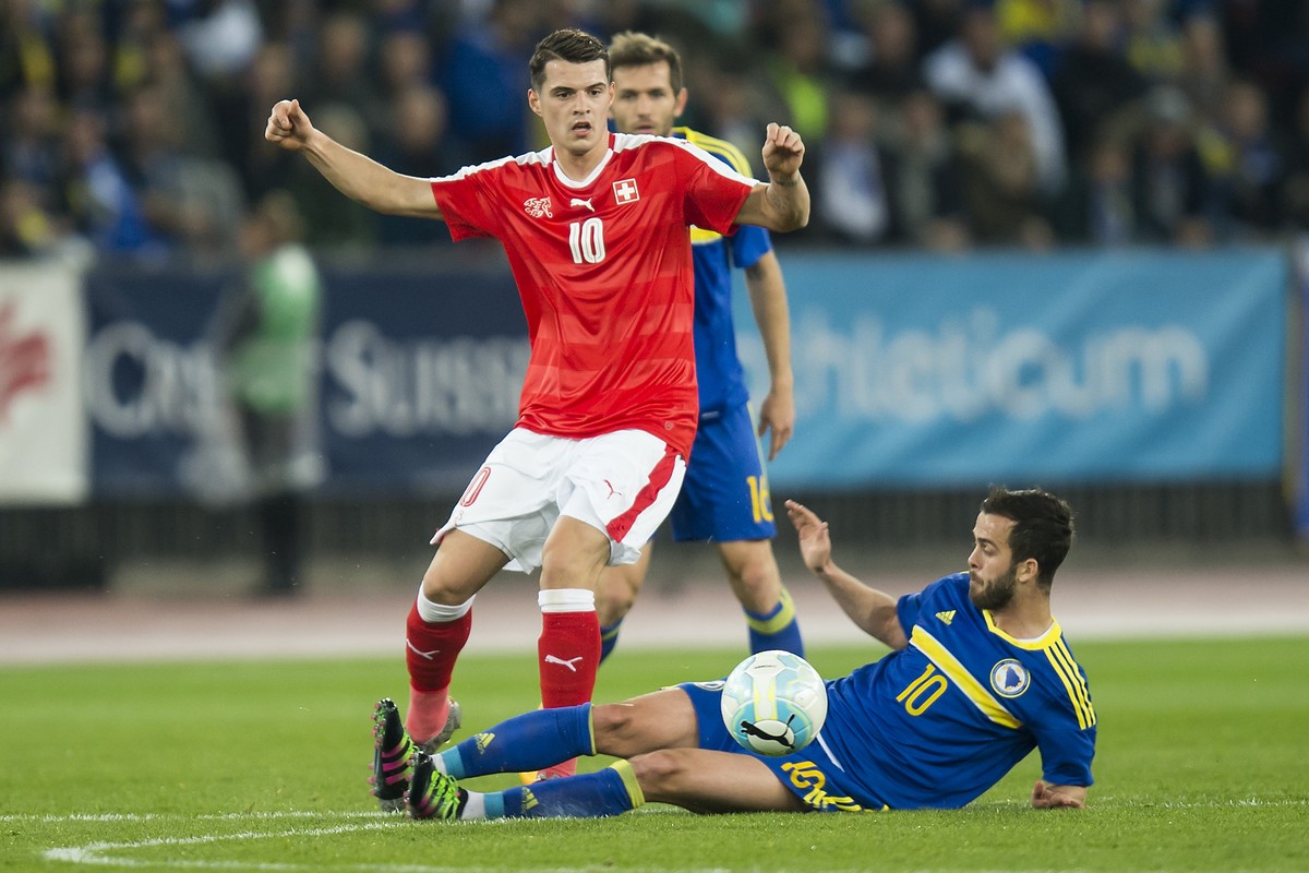Swiss midfielder Granit Xhaka, left, fights for the ball with Bosnia-Herzegovina's midfielder Miralem Pjanic, right, during the friendly soccer match between Switzerland and Bosnia and Herzegovin ...