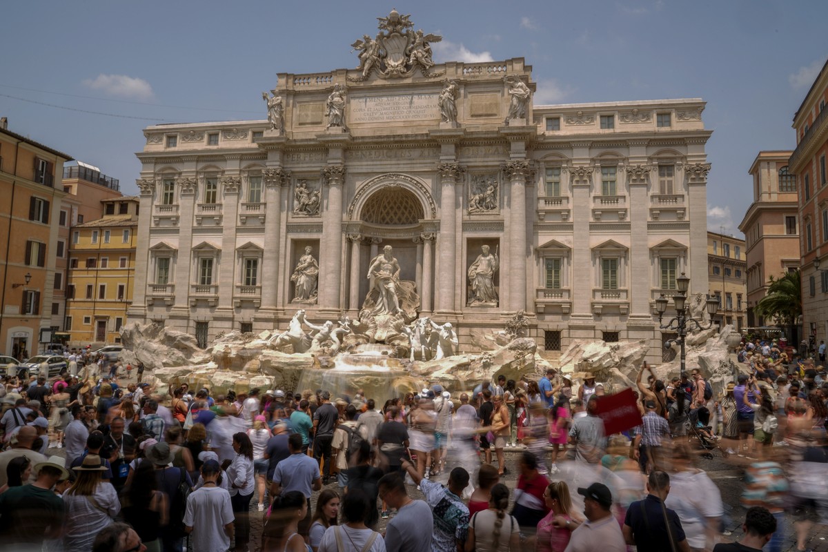 FILE - Tourists visit the Trevi Fountain in Rome, Friday, June 30, 2023. (AP Photo/Andrew Medichini, File)
Overtourism Explainer
