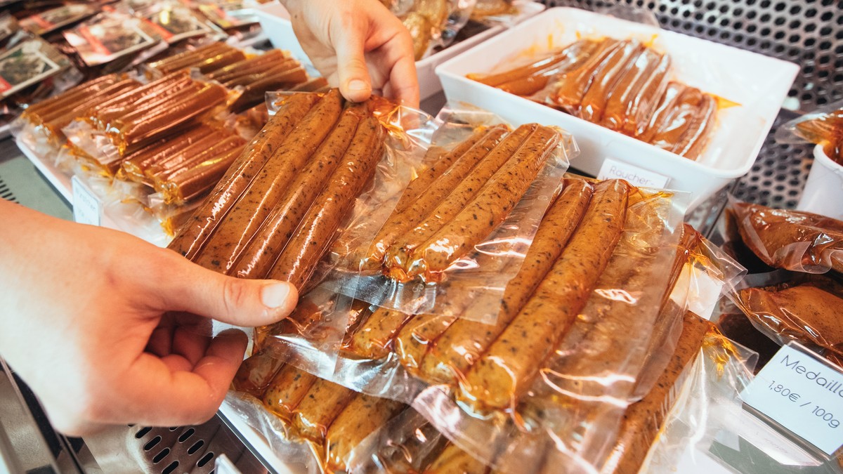 epa07851020 Vegan products are on display at the vegan sausage butcher shop L'herbivore in Berlin, Germany, 17 September 2019 (issued on 18 September 2019). The Sausage skin is made of a special  ...