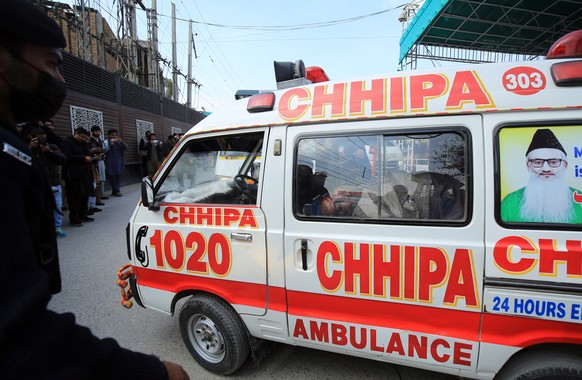 epa10439789 An ambulance shift victims of a blast at a Mosque, in Peshawar, Pakistan, 30 January 2023. At least 19 worshippers were killed and dozens injured in a blast during prayers at a Mosque situ ...