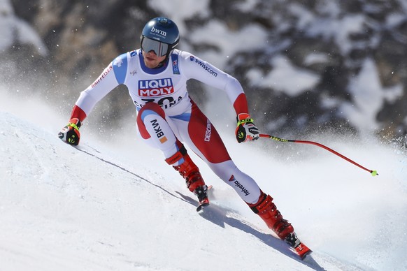 Switzerland&#039;s Niels Hintermann speeds down the course during a men&#039;s downhill training, at the alpine ski World Championships, in Cortina d&#039;Ampezzo, Italy, Friday, Feb. 12, 2021. (AP Ph ...