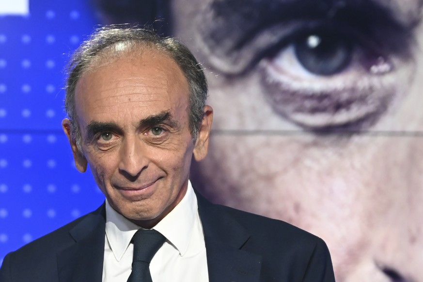 Provocative anti-immigration commentator Eric Zemmour poses before a live broadcast face-to-face televised debate with French far-left leader, Jean-Luc Melenchon, in Paris, Thursday Sept. 16, 2021. (B ...