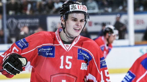 Suisse player Gregory Hofmann celebrates with the team after scoring during the game between Team Suisse and HC Davos at the 91th Spengler Cup ice hockey tournament in Davos, Switzerland, Saturday, De ...