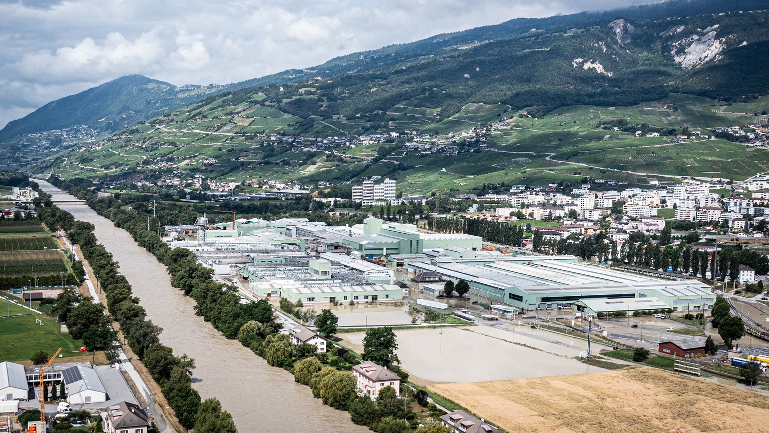 The Rhone River are overflowing in the industrial zone produces aluminium &quot;Novelis&quot; following the storms that caused major flooding, in Chippis, Switzerland, Sunday, June 30, 2024. (KEYSTONE ...