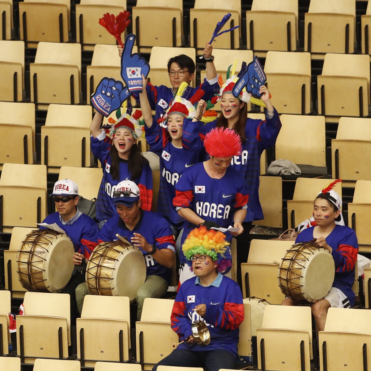 Group of South Korea's fans cheers for their team before the start of the Ice Hockey World Championships group B match between South Korea and Latvia at the Jyske Bank Boxen arena in Herning, Den ...