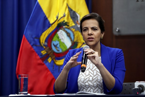 epa07498720 Ecuadoran Foreign Affairs Minister Jose Valencia (R) and Justice Minister Maria Paula Romo (L) addresses a press conference in Quito, Ecuador, 11 April 2019. Ecuador decided to withdraw th ...