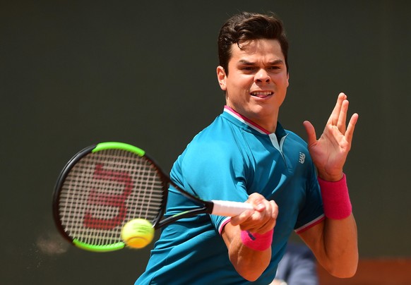 epa06009658 Milos Raonic of Canada in action against Pablo Carreno Busta of Spain during their men’s singles 4th round match during the French Open tennis tournament at Roland Garros in Paris, France, ...