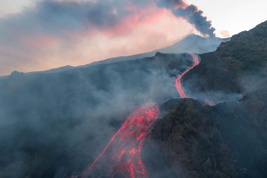 KEYPIX - epa13166535 Smoke rises as lava flows down Mount Etna during a period of heightened volcanic activity, near Catania, Sicily, southern Italy, 13 August 2026. According to Italy's National ...