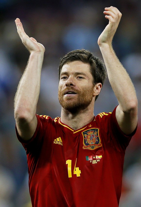 epa05838314 (FILE) A file picture dated 27 June 2012 of Spain's Xabi Alonso celebrating after winning the semi final match of the UEFA EURO 2012 between Portugal and Spain in Donetsk, Ukraine. Bayern Munich's Xabi Alonso confirmed on 09 March 2017 that he will retire at the end of the current season.  EPA/YURI KOCHETKOV UEFA Terms and Conditions apply http://www.epa.eu/downloads/UEFA-EURO2012-TCS.pdf