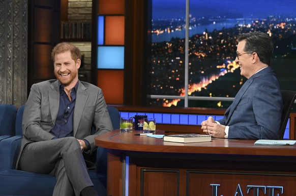 This image courtesy of CBS show Prince Harry, left, with host Stephen Colbert during a taping of &quot;The Late Show with Stephen Colbert&quot; on Tuesday, Jan. 10, 2023. (Scott Kowalchyk/CBS via AP)