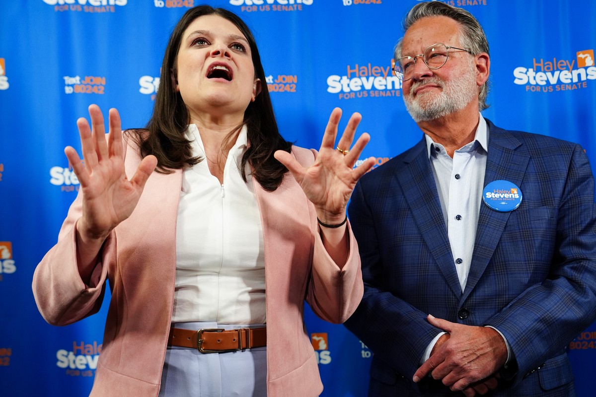 Rep. Haley Stevens, D-Mich., left, a candidate in the Democratic primary for U.S. Senate in Michigan, accompanied by Sen. Gary Peters, D-Mich., speaks during a campaign event at the UA Local Plumbers  ...
