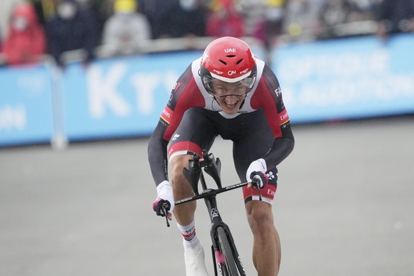 epa09313020 Danish rider Mikkel Bjerg of the UAE-Team Emirates approaches the finish line during the 5th stage of the Tour de France 2021, an individual time trial over 27.2 km from Change to Laval Es ...