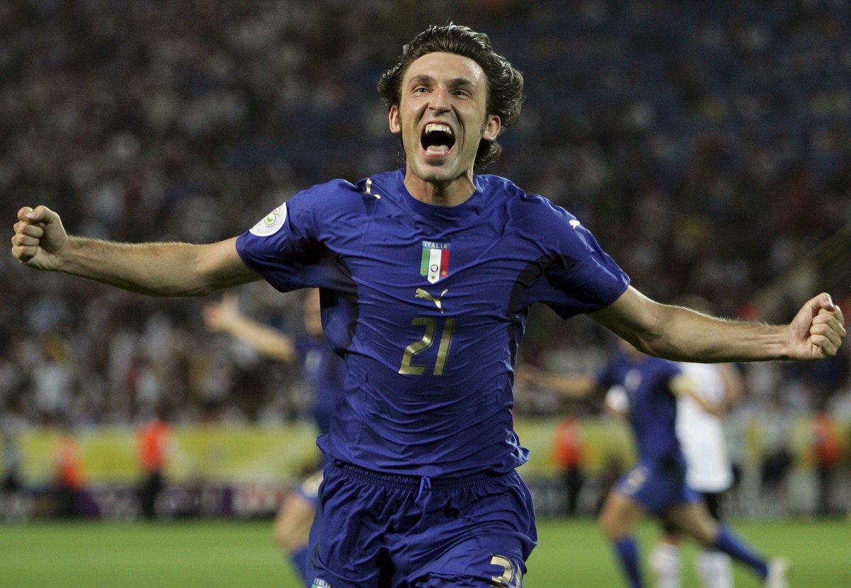 FILE - In this Tuesday, July 4, 2006 filer, Italy's Andrea Pirlo celebrates his side's first goal by teammate Fabio Grosso in the extra time of the semifinal World Cup soccer match between G ...