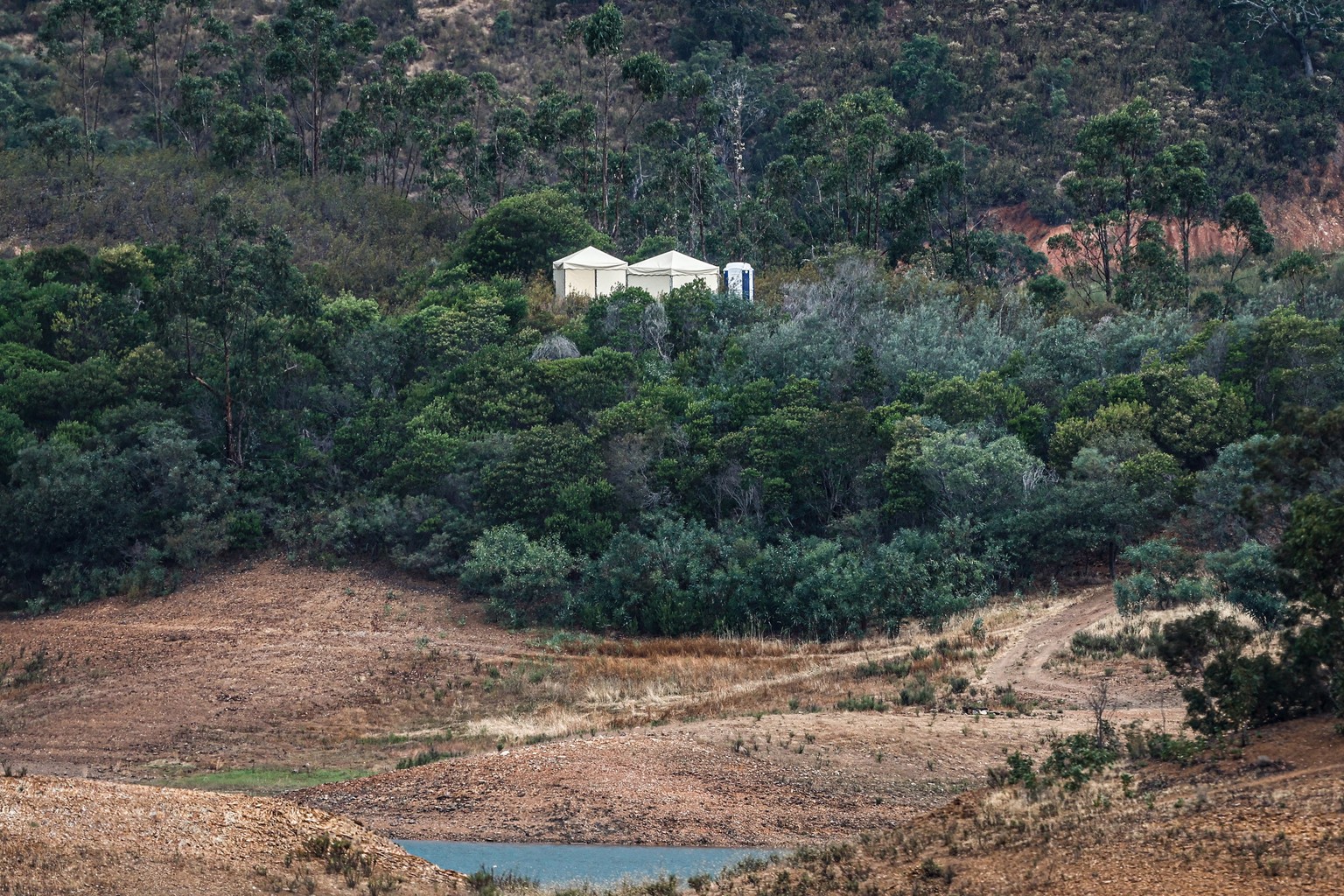 epa10645997 Tents erected in an improvised base camp of the Judicial Police (PJ) in the Arade dam area, Faro district, a day before the official start of a new search during the investigation of the ...