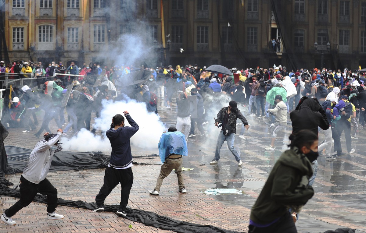 Anti-government protesters clash with police in Bogota, Colombia, Wednesday, May 5, 2021. The protests that began last week over a tax reform proposal continue despite President Ivan Duque's with ...