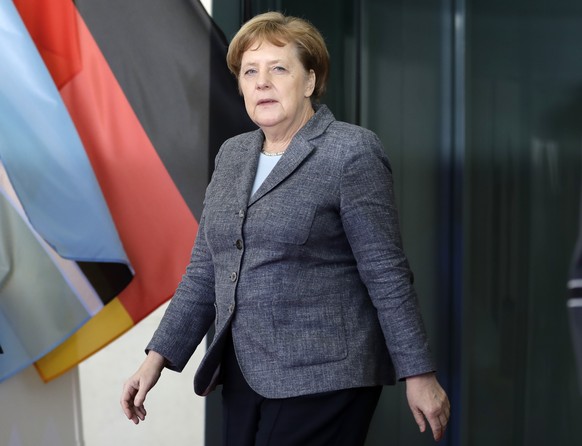German Chancellor Angela Merkel arrives to welcome the President of Botswana Seretse Khama Ian Khama for a meeting at the chancellery in Berlin, Germany, Tuesday, March 7, 2017. (AP Photo/Michael Sohn ...