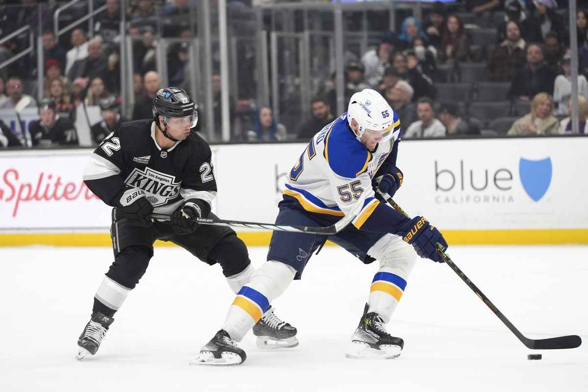 St. Louis Blues defenseman Colton Parayko (55) moves the puck past Los Angeles Kings left wing Kevin Fiala (22) during the second period of an NHL hockey game Wednesday, March 5, 2025, in Los Angeles. ...