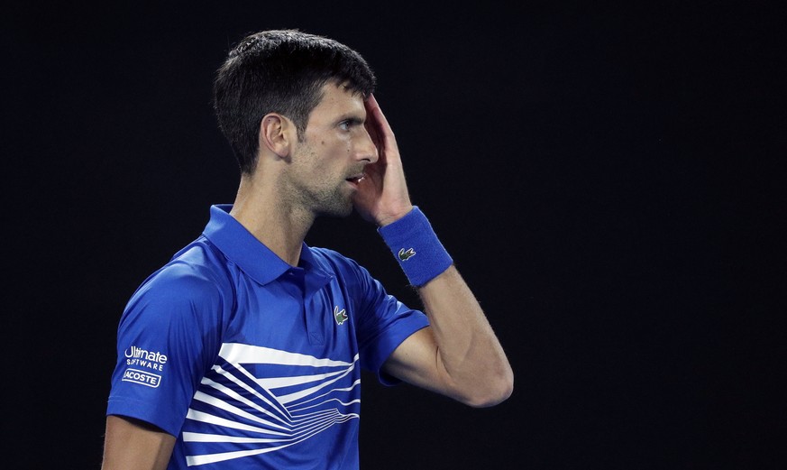 Serbia's Novak Djokovic waits to receive serve from Russia's Daniil Medvedev during their fourth round match at the Australian Open tennis championships in Melbourne, Australia, Monday, Jan. 21, 2019. ...