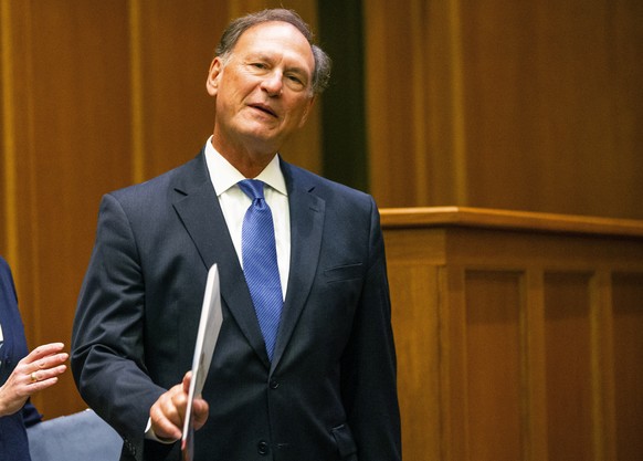 US Supreme Court Justice Samuel Alito waves before addressing the audience during the &quot;The Emergency Docket&quot; lecture Thursday, Sept. 30, 2021 in the McCartan Courtroom at the University of N ...