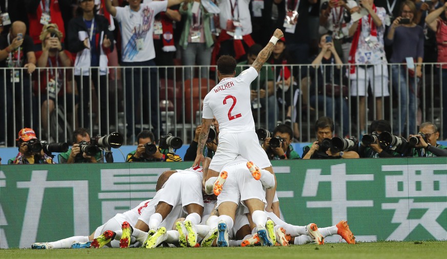 England players celebrate after England&#039;s Kieran Trippier scored the opening goal during the semifinal match between Croatia and England at the 2018 soccer World Cup in the Luzhniki Stadium in Mo ...