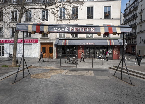 A closed restaurant in Paris, France, on Saturday, March 20, 2021. The French government has backed off from ordering a tough lockdown for Paris and several other regions despite an increasingly alarming situation at hospitals with a rise in the number of COVID-19 patients. (AP Photo/Rafael Yaghobzadeh)