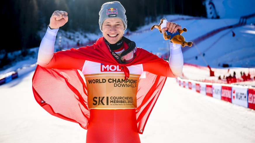 Gold medalist Marco Odermatt of Switzerland poses after the podium ceremony of the men's downhill race at the 2023 FIS Alpine Skiing World Championships in Courchevel/Meribel, France, Sunday, Feb ...