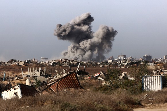 epa12430672 A photo taken while embedded with the Israeli Army and a plume of smoke rising above Gaza City during an Israeli strike in Gaza City, 03 October 2025 (issued 04 October 2025). Israel&#039; ...