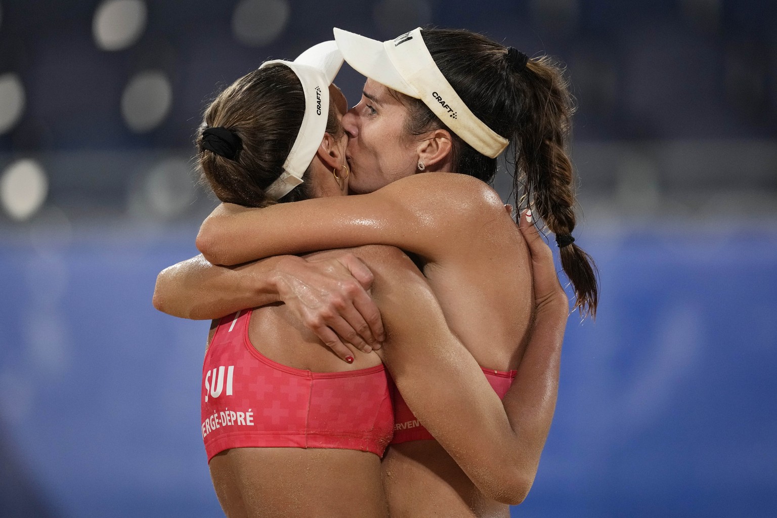 Anouk Verge-Depre, left, of Switzerland, and teammate Joana Heidrich celebrate winning a women&#039;s beach volleyball match against Switzerland at the 2020 Summer Olympics, Sunday, Aug. 1, 2021, in T ...