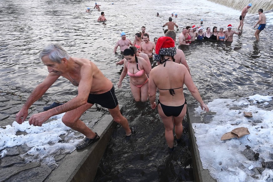 Christmas Eve swim of winter swimmers in Ostravice river, Frydek-Mistek, Czech Republic, on December 24, 2022.