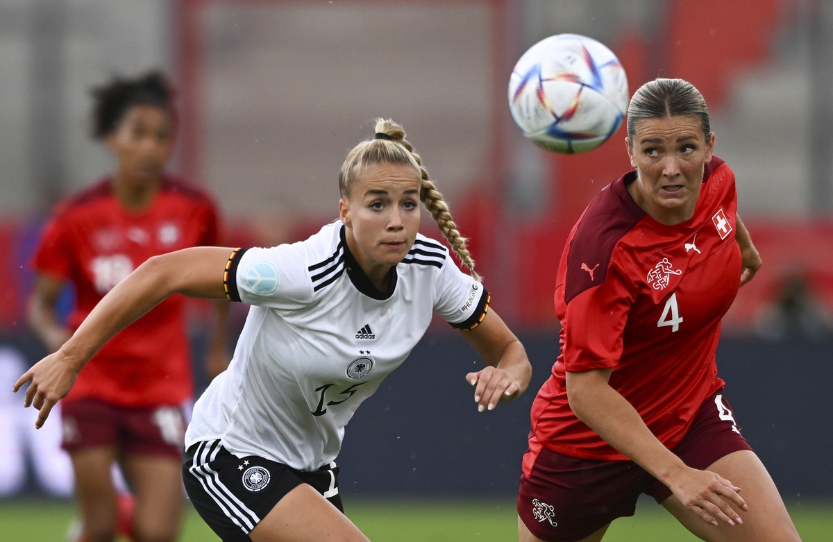 Germany's Giulia Gwinn, left, and Switzerland's Rachel Rinast fight for the ball during Germany - Switzerland soccer match, at Steigerwald Stadium in Erfurt, Germany, Friday. June 24, 2022.  ...