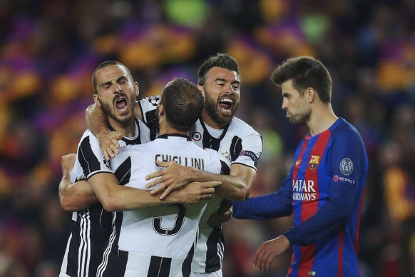 epa05916041 Juventus players (L-R) Leonardo Bonucci, Giorgio Chiellini and Andrea Barzagli celebrate at the end of the UEFA Champions League quarter final, second leg soccer match between FC Barcelona ...