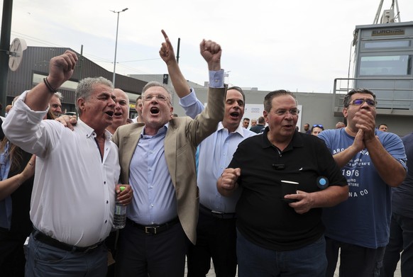 Supporters of the centre-right New Democracy react as they watch the exit polls at the party's headquarters in Athens, Greece, Sunday, June 25, 2023. The exit poll of Greece's second elected…