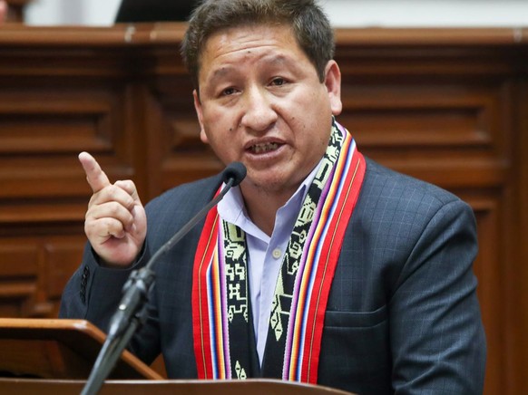 epa09432900 A handout photo made available by the Andean Agency shows the Peruvian Prime Minister, Guido Bellido, while addressing Congress, in Lima, Peru, 27 August 2021. The cabinet of ministers of  ...