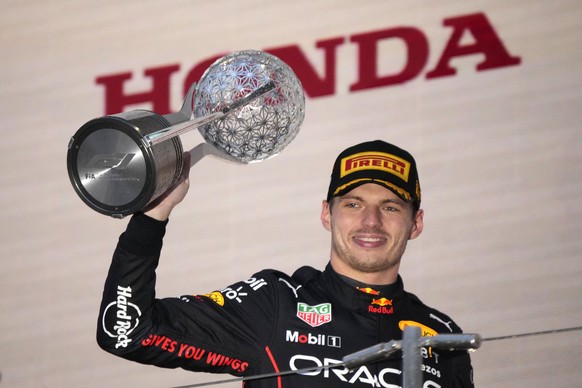 Red Bull driver Max Verstappen of the Netherlands celebrates his win during the Japanese Formula One Grand Prix at the Suzuka Circuit in Suzuka, central Japan, Sunday, Oct. 9, 2022. Verstappen secured ...