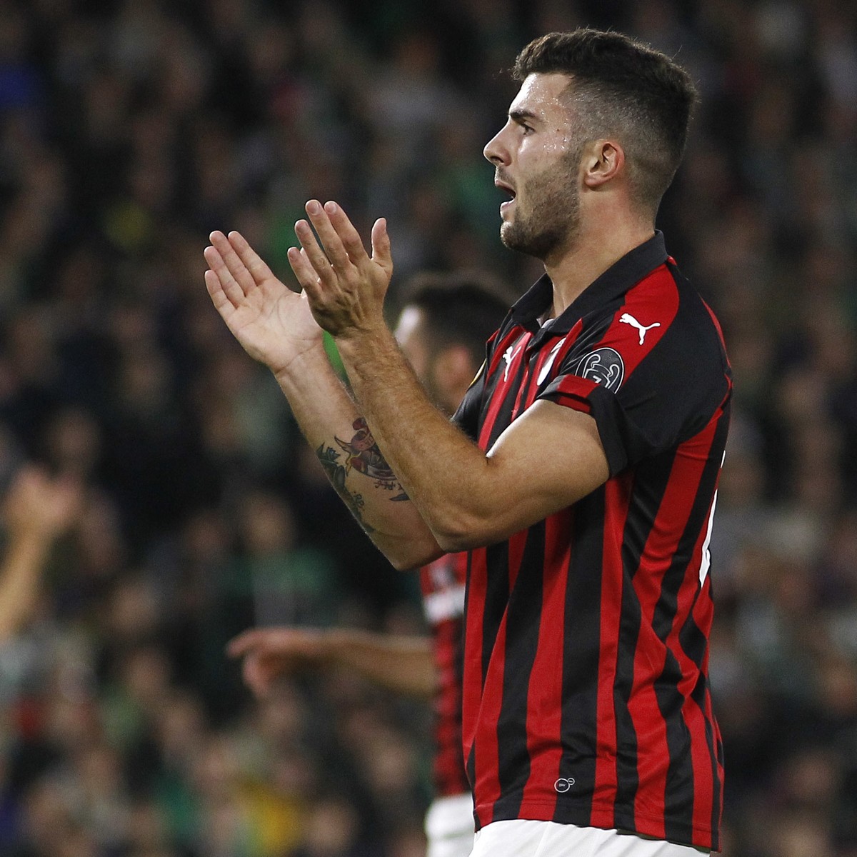 AC Milan's Patrick Cutrone reacts during the Europa League, Group F soccer match between AC Milan and Betis, at the Benito Villamarin Stadium in Seville, Spain, Thursday, Nov. 8, 2018. (AP Photo/ ...