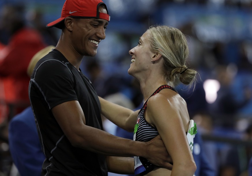 Canada&#039;s Brianne Theisen Eaton is greeted by husband Ashton Eaton after the women&#039;s heptathlon 800-meter heat during the athletics competitions of the 2016 Summer Olympics at the Olympic sta ...