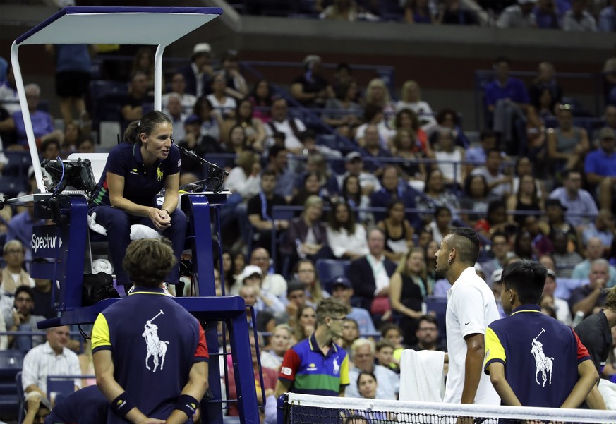 epa07809092 Chair umpire Eva Asderaki Moore (L) talks with Nick Kyrgios of Australia (R) during a break in his match against Andrey Rublev of Russia on day six of the US Open Tennis Championships at t ...