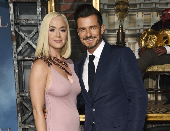 FILE - This Aug. 21, 2019 file photo shows Orlando Bloom, right, a cast member in the Amazon Prime Video series &quot;Carnival Row,&quot; with singer Katy Perry, at the premiere of the series in Los A ...